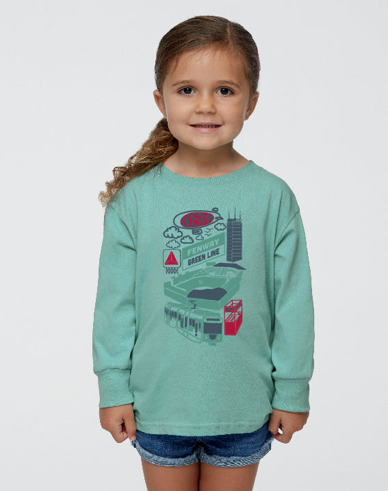 toddler girl wearing saltwater blue long sleeve t-shirt with hand drawn fenway park and green line trolley illustration